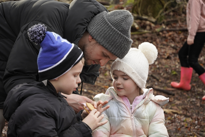two young children eating a smore.