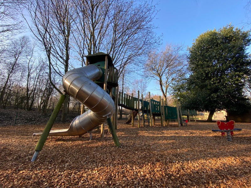 Photo of Pooley Country Park play area with a curly slide.