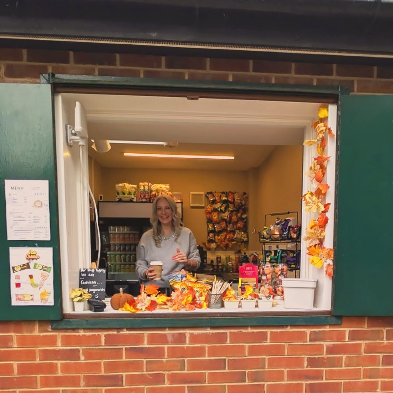 Someone serving coffee at The Kiosk